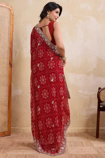 Entrancing red georgette bandhej print with cutwork lace border saree with mono banglory silk blouse