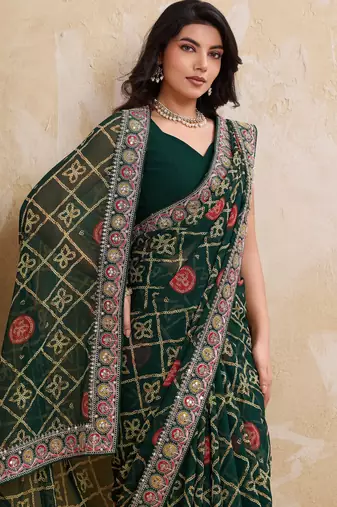 Inviting green georgette bandhej print with cutwork lace border saree with mono banglory silk blouse