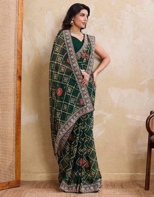 Inviting green georgette bandhej print with cutwork lace border saree with mono banglory silk blouse 3
