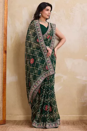 Inviting green georgette bandhej print with cutwork lace border saree with mono banglory silk blouse