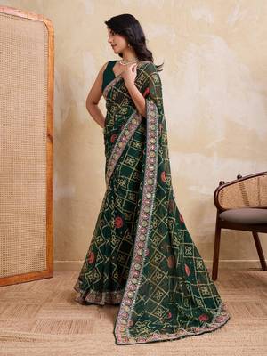 Inviting green georgette bandhej print with cutwork lace border saree with mono banglory silk blouse 4