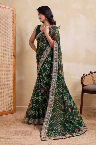 Inviting green georgette bandhej print with cutwork lace border saree with mono banglory silk blouse