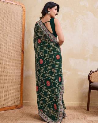 Inviting green georgette bandhej print with cutwork lace border saree with mono banglory silk blouse 5