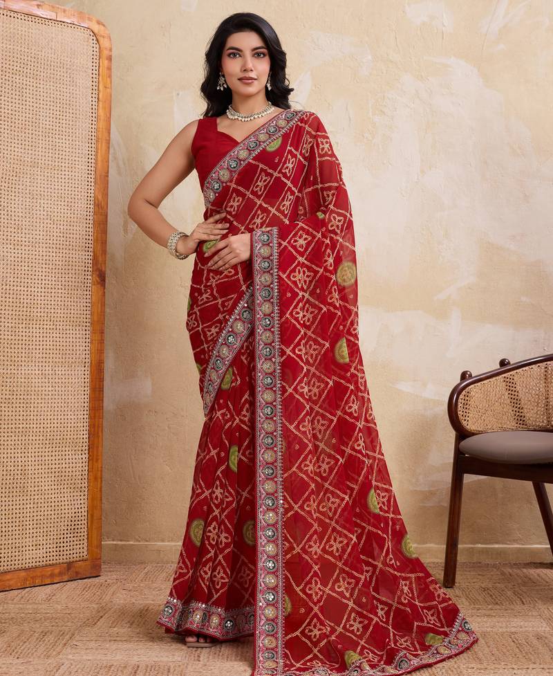Fascinating red georgette bandhej print with cutwork lace border saree with mono banglory silk blouse