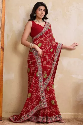 Fascinating red georgette bandhej print with cutwork lace border saree with mono banglory silk blouse