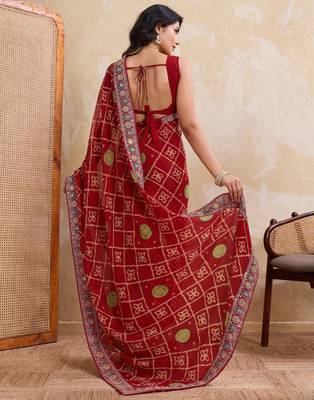 Fascinating red georgette bandhej print with cutwork lace border saree with mono banglory silk blouse 5