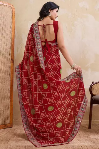 Fascinating red georgette bandhej print with cutwork lace border saree with mono banglory silk blouse