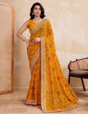 Intriguing yellow georgette bandhej print with cutwork lace border saree with mono banglory silk blouse 1