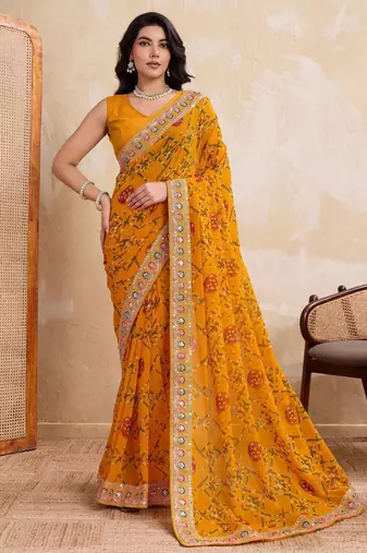 Intriguing yellow georgette bandhej print with cutwork lace border saree with mono banglory silk blouse