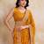 Intriguing yellow georgette bandhej print with cutwork lace border saree with mono banglory silk blouse