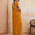Intriguing yellow georgette bandhej print with cutwork lace border saree with mono banglory silk blouse