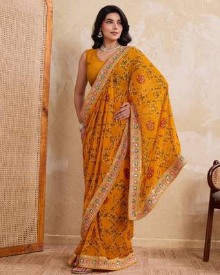 Intriguing yellow georgette bandhej print with cutwork lace border saree with mono banglory silk blouse 5