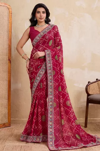 Appetizing pink georgette bandhej print with cutwork lace border saree with mono banglory silk blouse
