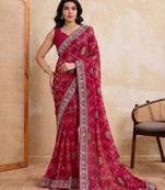 Appetizing pink georgette bandhej print with cutwork lace border saree with mono banglory silk blouse