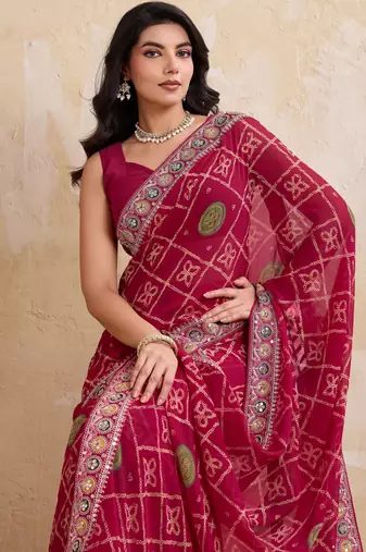 Appetizing pink georgette bandhej print with cutwork lace border saree with mono banglory silk blouse