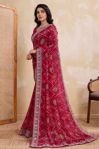Appetizing pink georgette bandhej print with cutwork lace border saree with mono banglory silk blouse