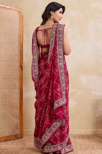 Appetizing pink georgette bandhej print with cutwork lace border saree with mono banglory silk blouse