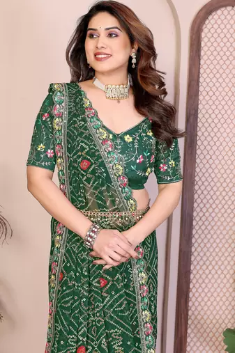 Pleasant green georgette bandhej print with cutwork lace border saree with mono banglory silk blouse