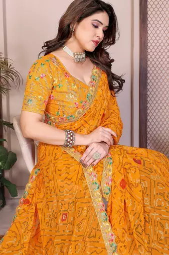 Likable yellow georgette bandhej print with cutwork lace border saree with mono banglory silk blouse