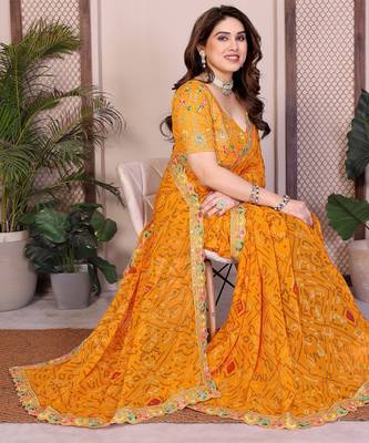 Likable yellow georgette bandhej print with cutwork lace border saree with mono banglory silk blouse 3