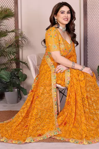 Likable yellow georgette bandhej print with cutwork lace border saree with mono banglory silk blouse