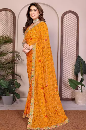 Likable yellow georgette bandhej print with cutwork lace border saree with mono banglory silk blouse