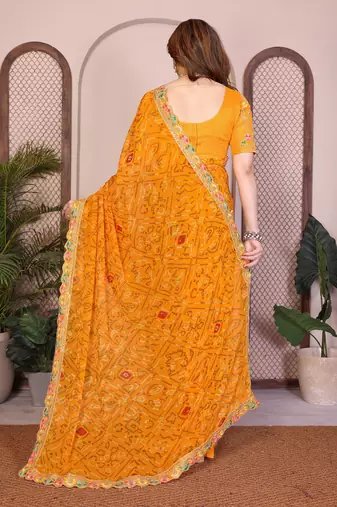 Likable yellow georgette bandhej print with cutwork lace border saree with mono banglory silk blouse