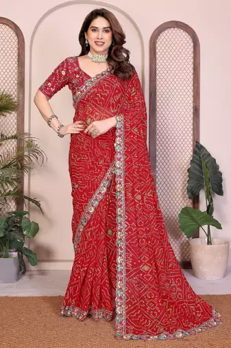 Endearing red georgette bandhej print with cutwork lace border saree with mono banglory silk blouse