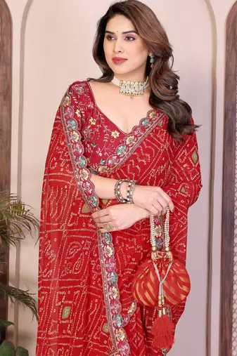 Endearing red georgette bandhej print with cutwork lace border saree with mono banglory silk blouse