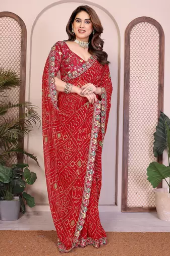 Endearing red georgette bandhej print with cutwork lace border saree with mono banglory silk blouse