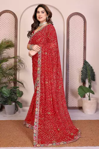 Endearing red georgette bandhej print with cutwork lace border saree with mono banglory silk blouse