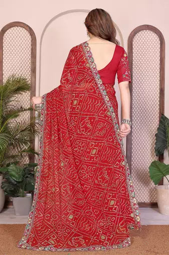 Endearing red georgette bandhej print with cutwork lace border saree with mono banglory silk blouse