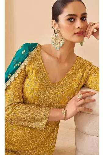 Yellow pure geogette full stitched suit free size upto 42
