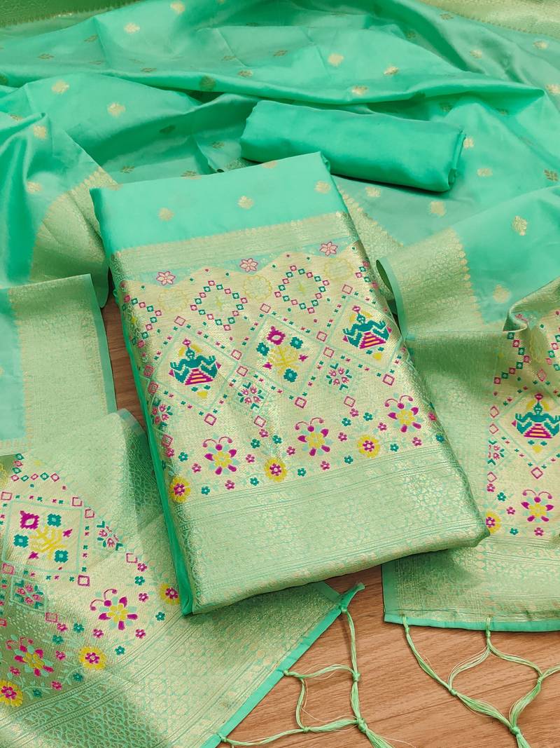 Sea green soft banarasi silk pure zari woven design dress material