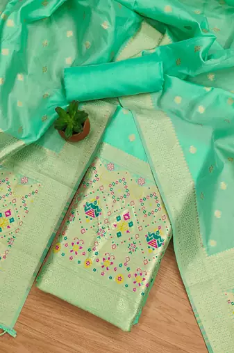 Sea green soft silk blend silk pure zari woven dress material