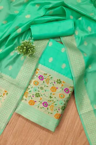 Sea green soft silk blend silk pure zari woven dress material
