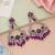 Purple color kundan earrings