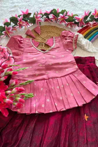 Girls pink tissue silk choli with ranipink floral embroidered lehenga set