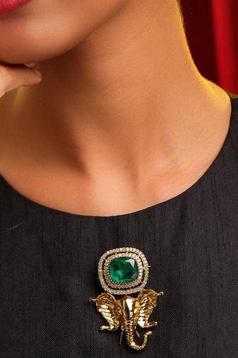 Gold plated kundan green stones brooch