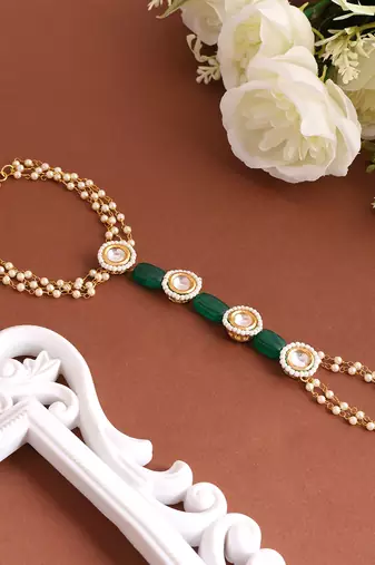 Gold plated kundan green stones haath phool