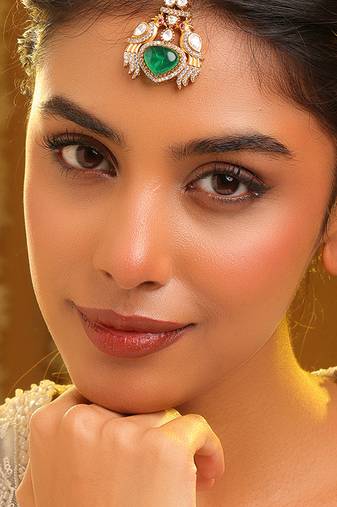 Gold plated kundan green stones maang tikka