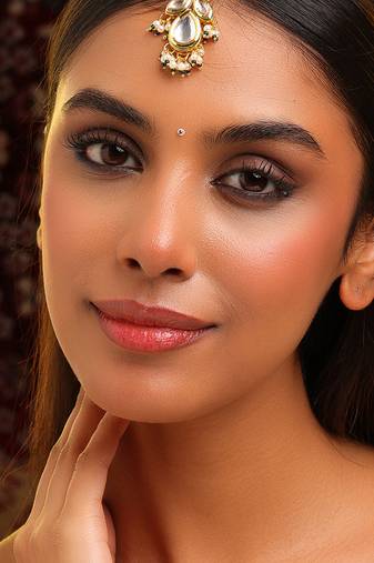 Gold plated kundan green stones maang tikka