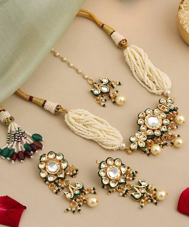 Gold plated kundan green stones choker necklace set with maang tikka