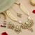 Gold plated kundan green stones necklace set with maang tikka