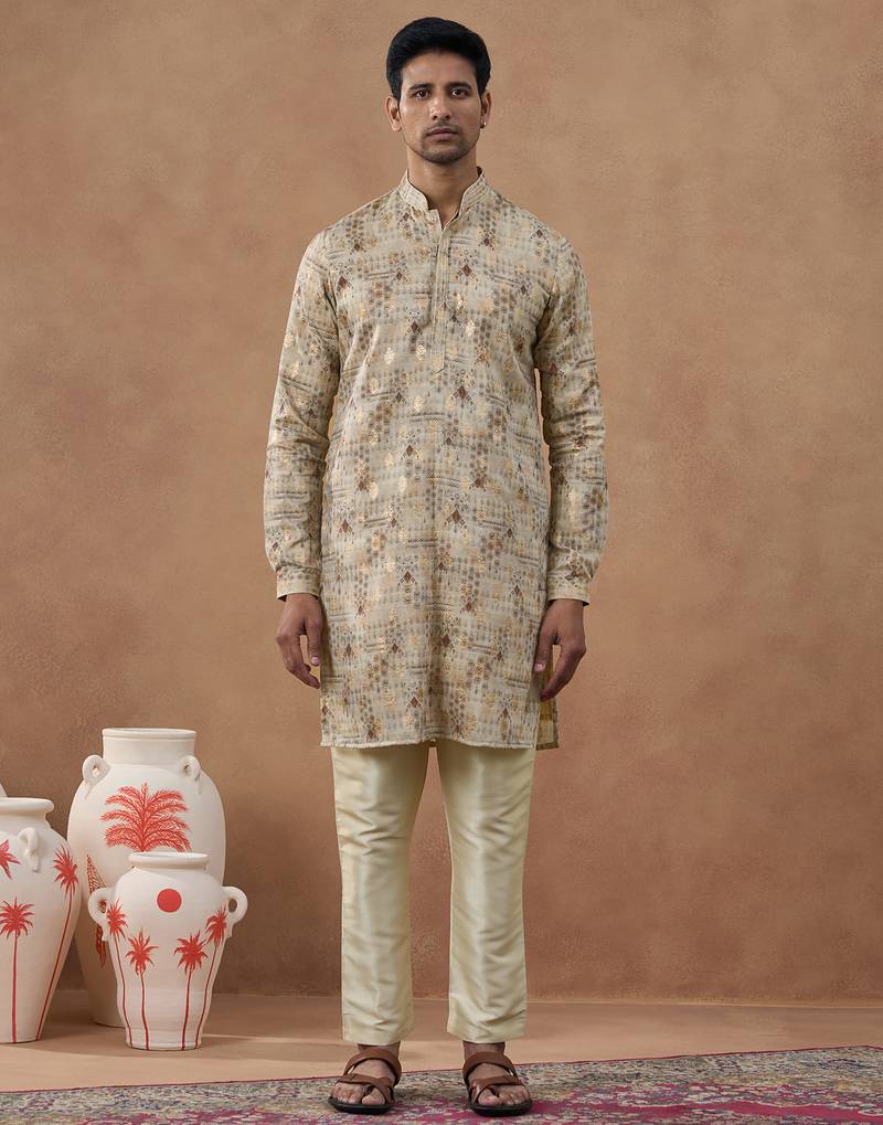 Beige kurta set with subtle gold detailing