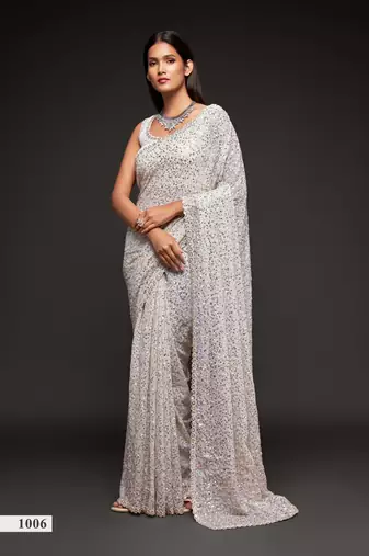 White georgette saree with thread & multiple sequins embroidery