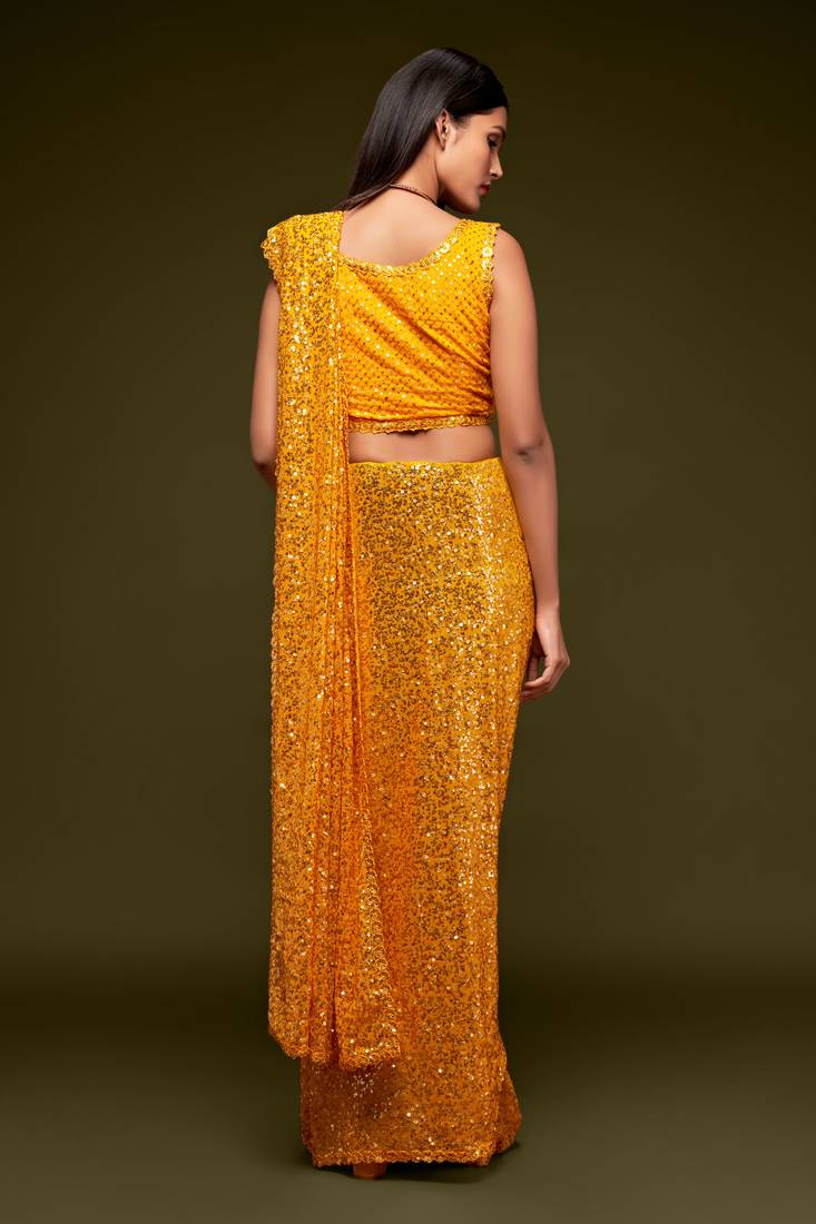 Yellow georgette saree with thread & multiple sequins embroidery