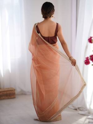 Orange exclusive dual shade gold net sequins saree with lace border 2