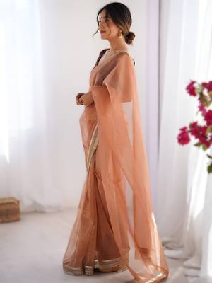Orange exclusive dual shade gold net sequins saree with lace border 3