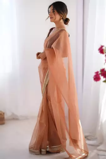 Orange exclusive dual shade gold net sequins saree with lace border